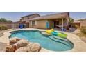 Inviting backyard pool with patio and relaxing hammock at 9909 W Miami St, Tolleson, AZ 85353