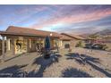 Backyard patio with seating area and mountain views at 10255 E Golden Rim Cir, Gold Canyon, AZ 85118