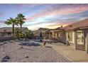Backyard patio with seating area and mountain views at 10255 E Golden Rim Cir, Gold Canyon, AZ 85118
