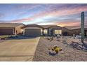 Front view of a single-story house with desert landscaping at 10255 E Golden Rim Cir, Gold Canyon, AZ 85118