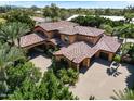 Grand estate with expansive grounds and luxurious features at 11571 E Cochise Dr, Scottsdale, AZ 85259