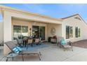 Wide angle shot of a covered patio with patio furniture and desert landscaping at 12808 W Nogales Dr, Sun City West, AZ 85375