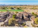 Community overview, showcasing homes with Spanish tile roofs and a golf course view at 19550 N Grayhawk Dr # 1124, Scottsdale, AZ 85255