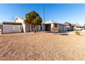 Single story home with a large backyard and mature trees at 2204 E Edgewood Ave, Mesa, AZ 85204