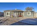 Gray house with front porch and small yard at 2410 W Papago St, Phoenix, AZ 85009