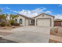 Stunning one-story house with a two-car garage and nicely landscaped front yard at 24147 N 165Th Ln, Surprise, AZ 85387