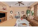 Bright living room with ample natural light and cozy seating at 28175 N 123Rd Ln, Peoria, AZ 85383