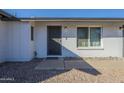 House exterior featuring a gray front door and stone pathway at 2914 E Cactus Rd, Phoenix, AZ 85032
