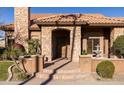 Inviting front entry with stone detailing and fountain at 6302 E Monte Cristo Ave, Scottsdale, AZ 85254