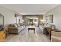 Spacious living room with comfortable seating and access to a patio at 649 S Arrowwood Way, Mesa, AZ 85208