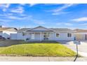 Charming single story home with a landscaped front yard and covered porch at 7607 N 42Nd Ln, Phoenix, AZ 85051