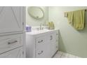Updated bathroom with a white vanity and modern fixtures at 9270 W Morrow Dr, Peoria, AZ 85382