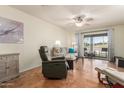 Bright living room featuring hardwood floors and patio access at 9270 W Morrow Dr, Peoria, AZ 85382