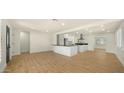 Bright, open-concept living area with wood floors and modern finishes at 1036 E Glenn Dr, Phoenix, AZ 85020