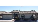 Single-story home with tile roof and attached garage at 14371 W Morning Star Trl, Surprise, AZ 85374