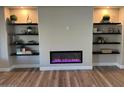 Modern fireplace with built-in shelving at 15856 W Sage Trl, Surprise, AZ 85374