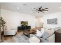 Relaxing living area featuring shiplap walls, comfortable seating, and a large flat-screen TV at 1822 N Oracle Cir, Mesa, AZ 85203