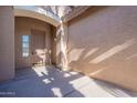 Front entry with arched entryway and tile flooring at 18630 E Seagull Dr, Queen Creek, AZ 85142