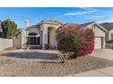 House exterior showcasing a well-maintained front yard with blooming flowers at 1911 S Saddle St, Gilbert, AZ 85233