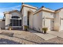 Exterior view of the home's entrance with walkway and landscaping at 1911 S Saddle St, Gilbert, AZ 85233