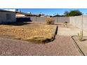 Large backyard with gravel and patchy grass at 1938 E Ardmore Dr, Phoenix, AZ 85042