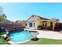 Inviting backyard oasis with a sparkling pool and patio at 20031 N 22Nd Pl, Phoenix, AZ 85024