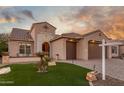 Stunning curb appeal featuring a two-car garage and well-maintained landscaping at 2562 N 169Th Ave, Goodyear, AZ 85395