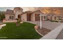 Inviting home exterior with a two-car garage and attractive landscaping at 2562 N 169Th Ave, Goodyear, AZ 85395