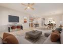 Open concept living room, dining, and kitchen with modern decor at 30723 N 25Th Dr, Phoenix, AZ 85085