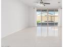 Bright living room with tile floors and sliding glass doors to backyard at 308 E Hawaii Dr, Casa Grande, AZ 85122