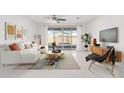 Living room with white sectional sofa and modern decor at 308 E Hawaii Dr, Casa Grande, AZ 85122