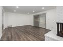Bright and airy living room with hardwood floors and sliding door access to backyard at 3250 W Mercer N Ln, Phoenix, AZ 85029