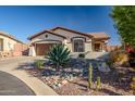 Single-story home with desert landscaping and two-car garage at 41240 N Shadow Creek Ct, Anthem, AZ 85086