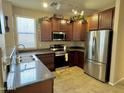 Modern kitchen with stainless steel appliances and granite countertops at 4332 E Oakland St, Gilbert, AZ 85295