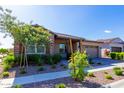 Attractive curb appeal with stone accents, shutters, and a well-maintained front yard at 4506 S Eastern Run, Mesa, AZ 85212