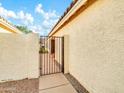 View of the side yard with a gate leading to the backyard at 5455 E Fairfield St, Mesa, AZ 85205