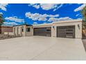 Spacious garage with plenty of room for parking, storage and epoxy flooring providing a clean aesthetic at 6712 E Pershing Ave, Scottsdale, AZ 85254