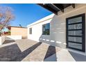 Private patio with modern pavers and access to the home at 6712 E Pershing Ave, Scottsdale, AZ 85254
