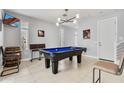 Spacious game room featuring a stylish billiard table, modern lighting, and comfortable seating at 6850 E Mcdowell Rd # 72, Scottsdale, AZ 85257
