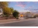 Stunning curb appeal, well-manicured lawn, and charming entryway at 8451 W Daley Ln, Peoria, AZ 85383