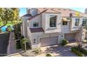 Beautiful two-story townhouse with a private garage and manicured landscaping in a golf course community at 8989 N Gainey Center Dr # 222, Scottsdale, AZ 85258