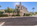 Modern townhome exterior with desert landscaping at 8989 N Gainey Center Dr # 222, Scottsdale, AZ 85258