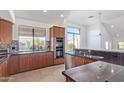 Modern kitchen with granite counters, stainless steel appliances, and ample cabinetry at 8989 N Gainey Center Dr # 222, Scottsdale, AZ 85258