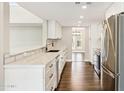 Modern kitchen with white cabinets and stainless steel appliances at 9412 N 33Rd Way, Phoenix, AZ 85028