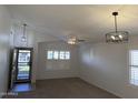 Bright living room featuring vaulted ceilings and modern light fixtures, offering an open and inviting space at 10245 W Jessie Ln, Peoria, AZ 85383