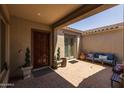 Private courtyard with seating area and potted plants at 10550 E Sanger Ave, Mesa, AZ 85212