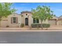 Charming single-story home with desert landscaping, a paved driveway, and an attached two-car garage at 10550 E Sanger Ave, Mesa, AZ 85212