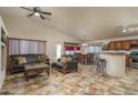 Spacious living room featuring a comfortable seating area and tile floors at 11246 W Chase Dr, Avondale, AZ 85323