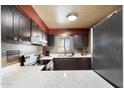 Modern kitchen with stainless steel appliances and white quartz countertops at 131 N Higley Rd # 213, Mesa, AZ 85205