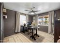 Bright home office with built-in shelving and large window at 1432 E Lupine Ave, Phoenix, AZ 85020